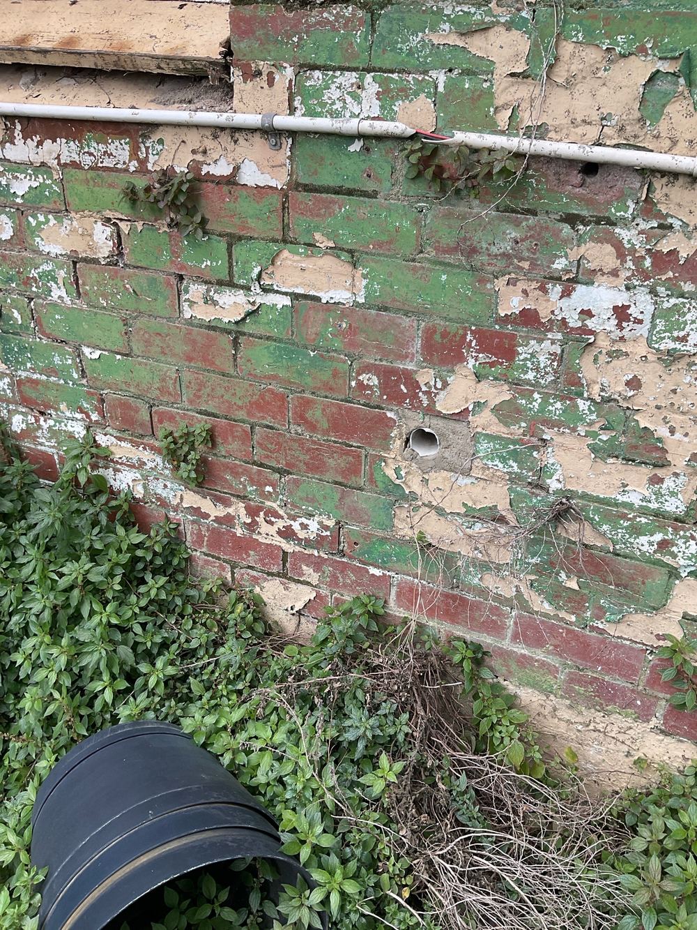 Drainage pipe left disconnected from its inlet, found during a defect investigation inspection in Richmond