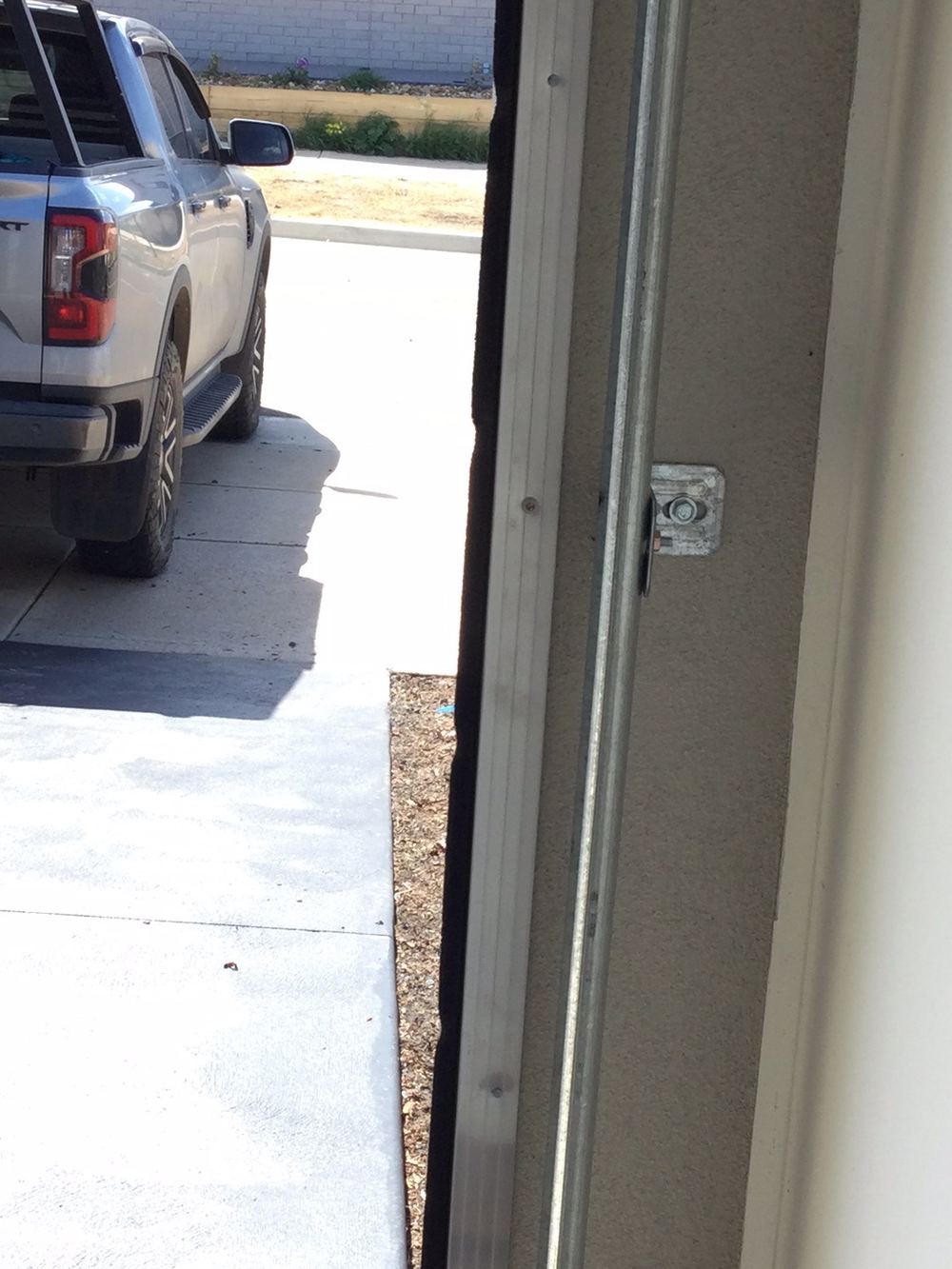 Loose garage door brush seal still unresolved on the return visit, Wyndham Vale