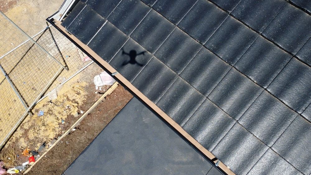 Gutters still holding debris at the reinspection visit, Wyndham Vale