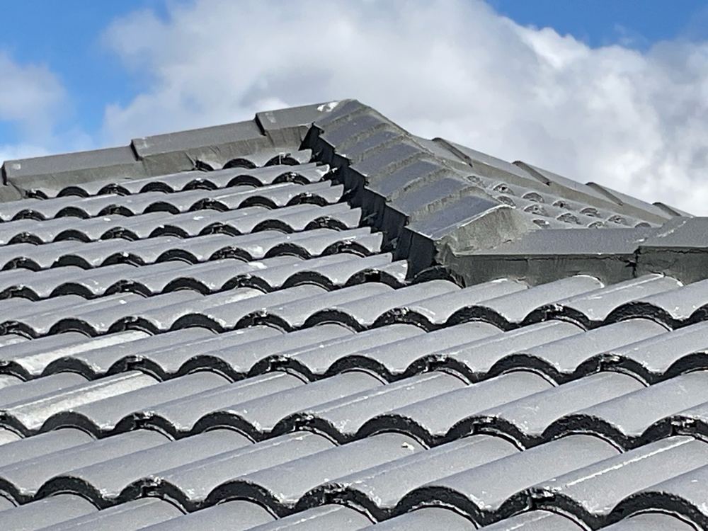 Broken tile underlap that would let heavy rain past the roof covering, found during a pre-handover inspection in Wyndham Vale
